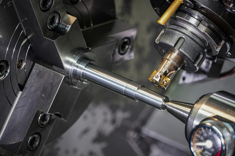 CNC turn-mill machining a precision steel shaft